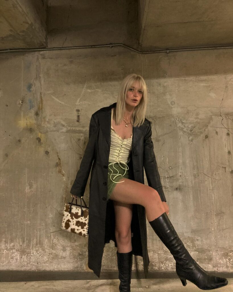 Outfit photo of a person wearing a y2k vintage leather jacket