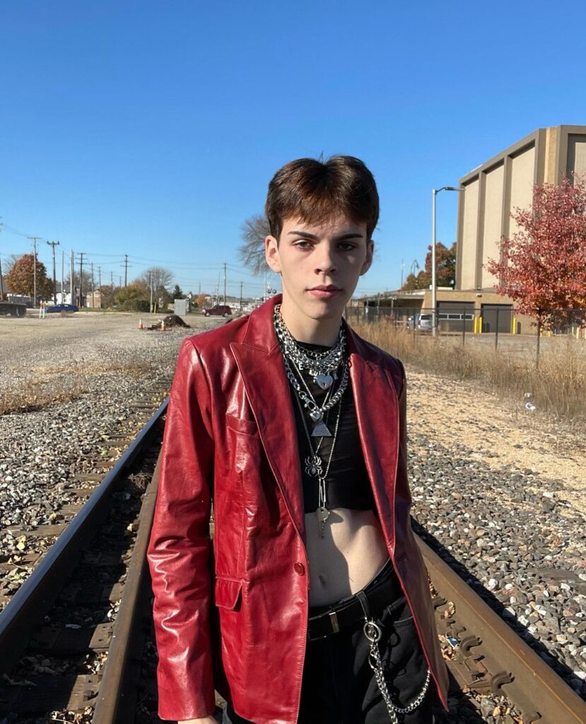 Outfit photo of a person wearing a vintage leather jacket
